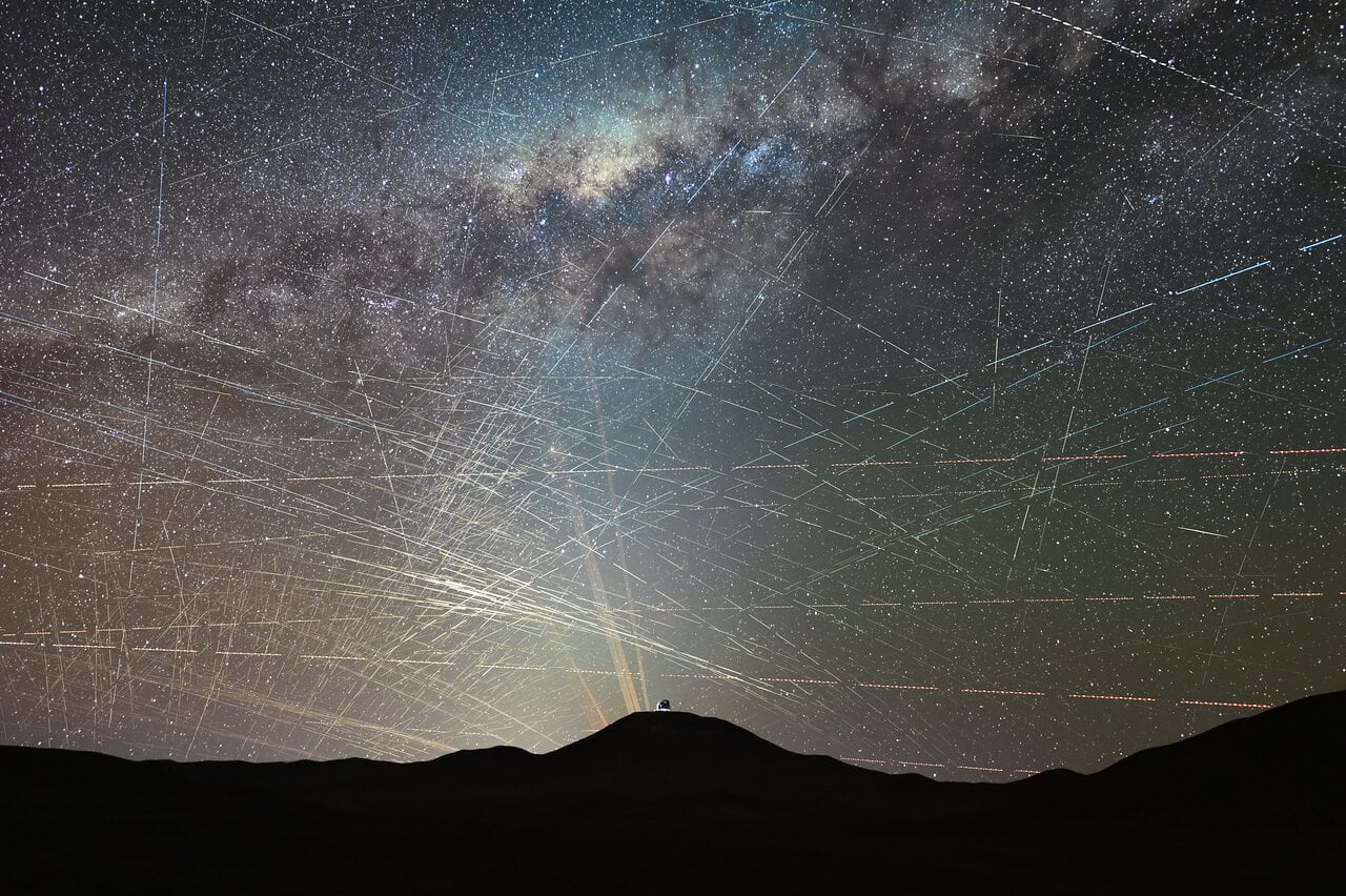 Time-lapse photograph showing satellite streaks crossing the night sky above ESO's Very Large Telescope in Chile's Atacama Desert