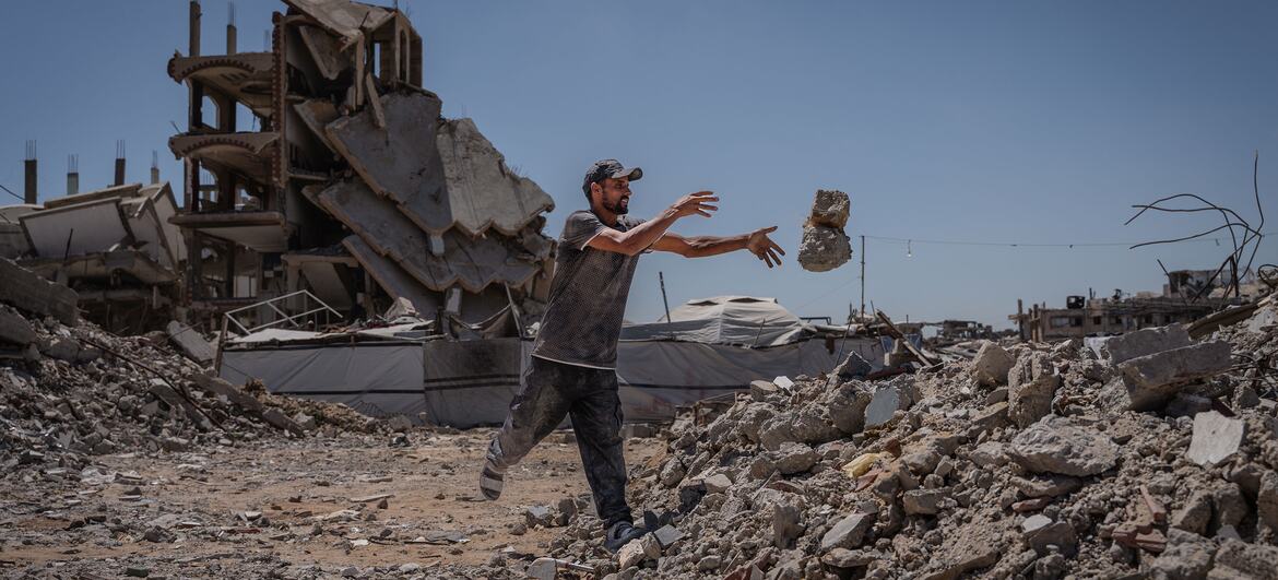 Man clearing rubble in Jabalia camp in northern Gaza, amid destruction from Israeli military operations in June 2026