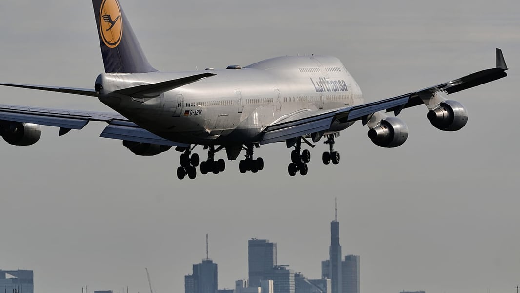 Lufthansa plane at Frankfurt Airport representing Germany emigration trends