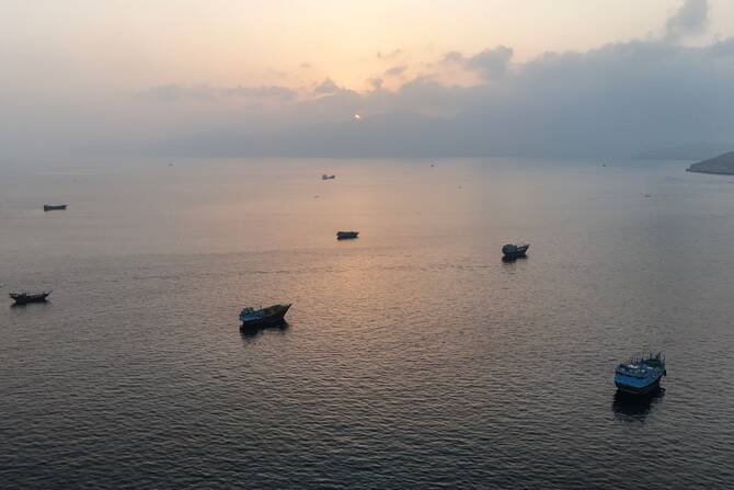 Strait of Hormuz shipping lane with tankers, UNCTAD economic fallout report July 2026