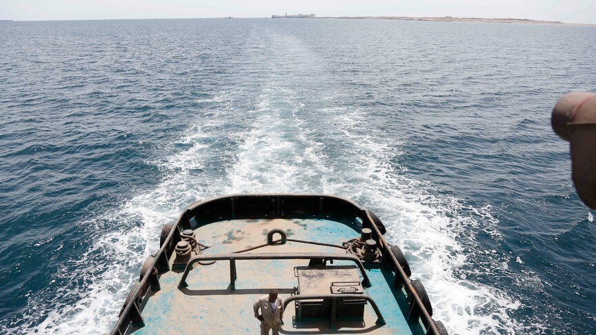 Houthi fighters with weapons in Yemen amid maritime blockade declaration against Saudi Arabia
