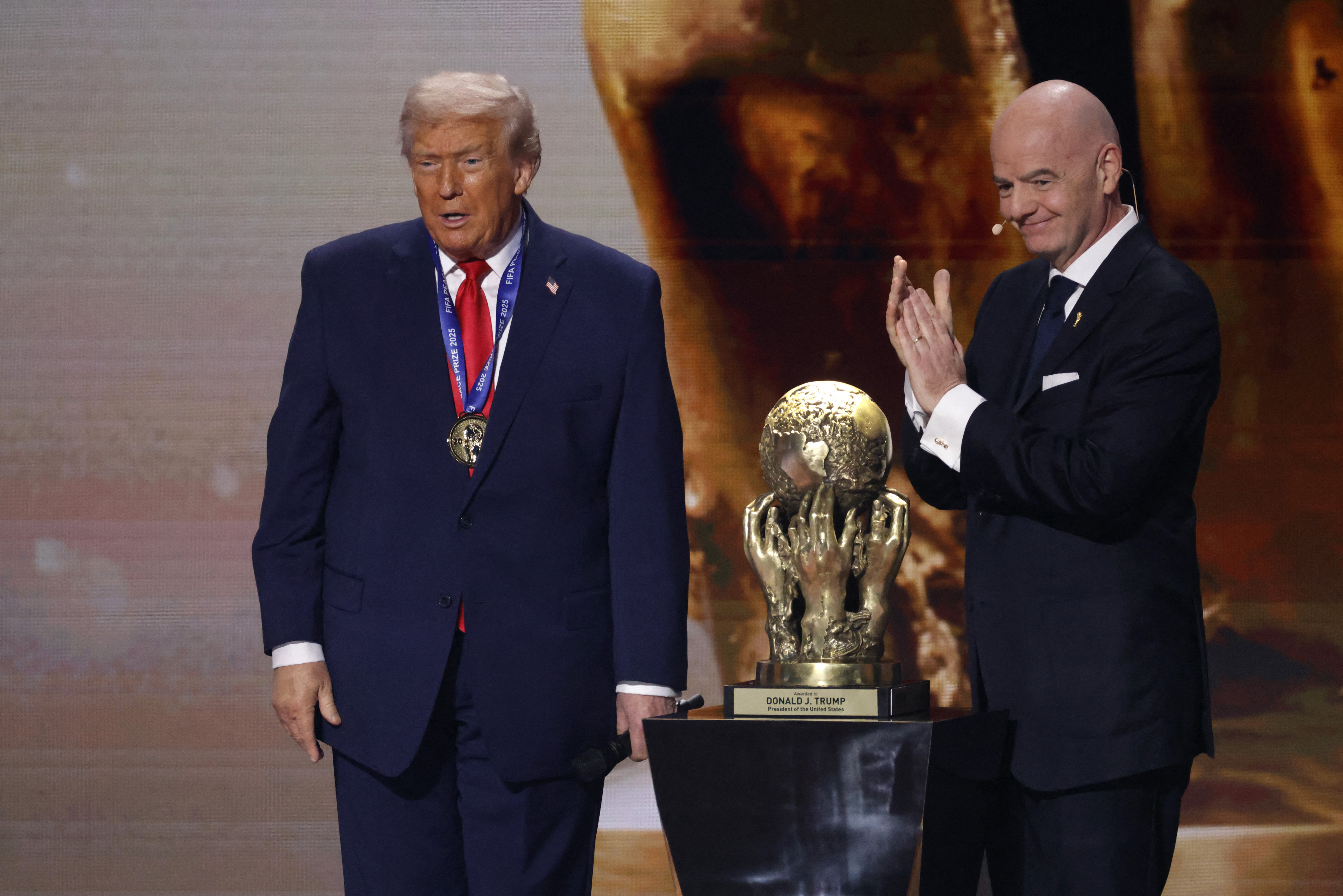 FIFA President Gianni Infantino presents Donald Trump with the FIFA Peace Prize at the Kennedy Center draw ceremony