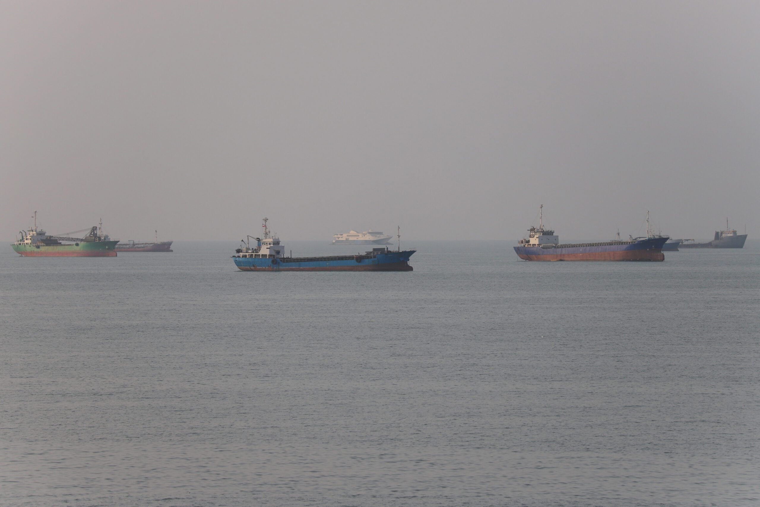 Commercial vessels transiting the Strait of Hormuz near Bandar Abbas, Iran, as US-Iran talks unfold in Doha