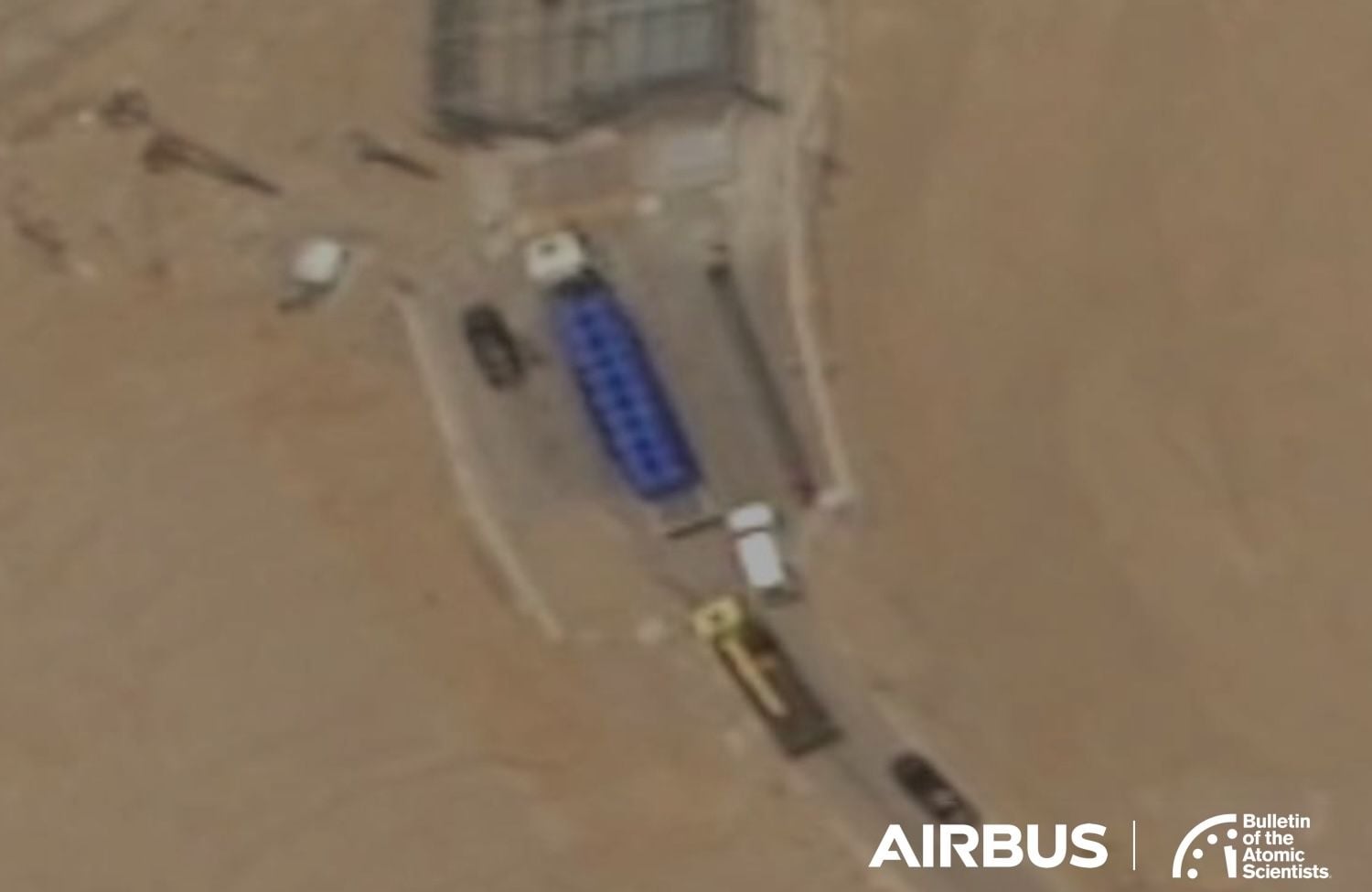 Satellite image showing trucks at Iran's Isfahan underground nuclear complex south tunnel entrance on June 9 2025