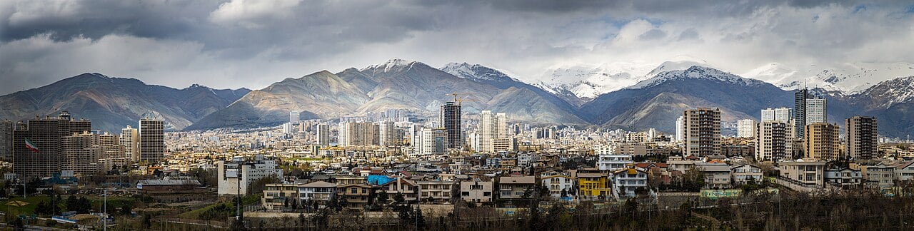 Tehran skyline with snow-capped Alborz mountains in background on a clear day