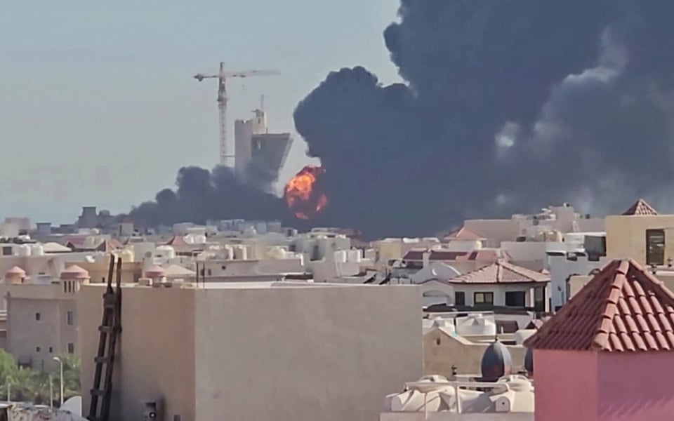 Smoke rises over Kuwait following an Iranian strike as the US-Iran conflict spreads across the Gulf