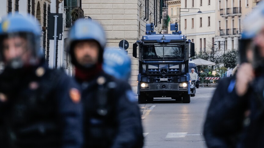 Italian police officers during arrest operation in northern Italy amid nationwide youth crime crackdown