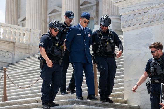 US Capitol Police arrest Air Force Major Jason Watson on Capitol steps during Trump impeachment protest