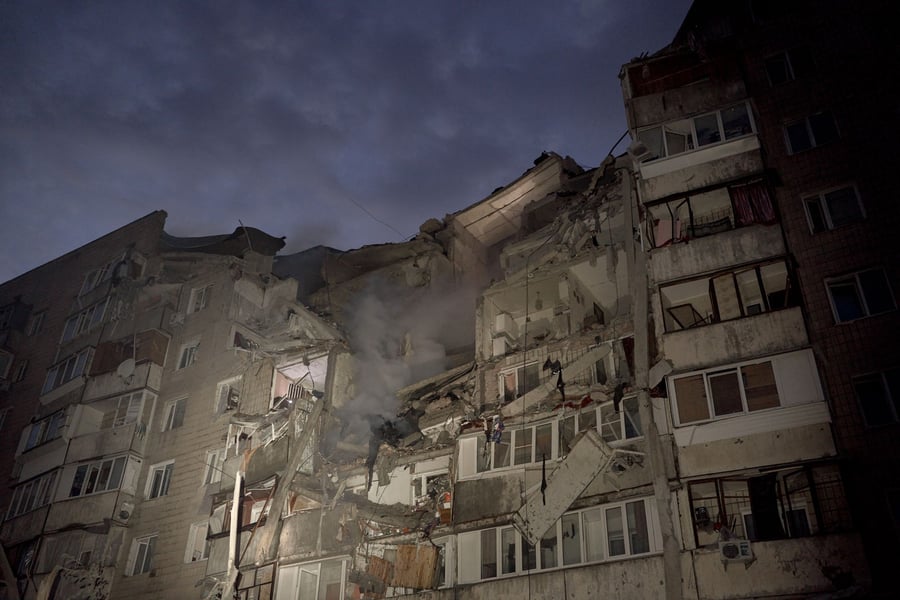 Rescuers work at nine-story residential building in Kyiv Podilskyi district after Russian missile strike destroyed top floors July 6 2026