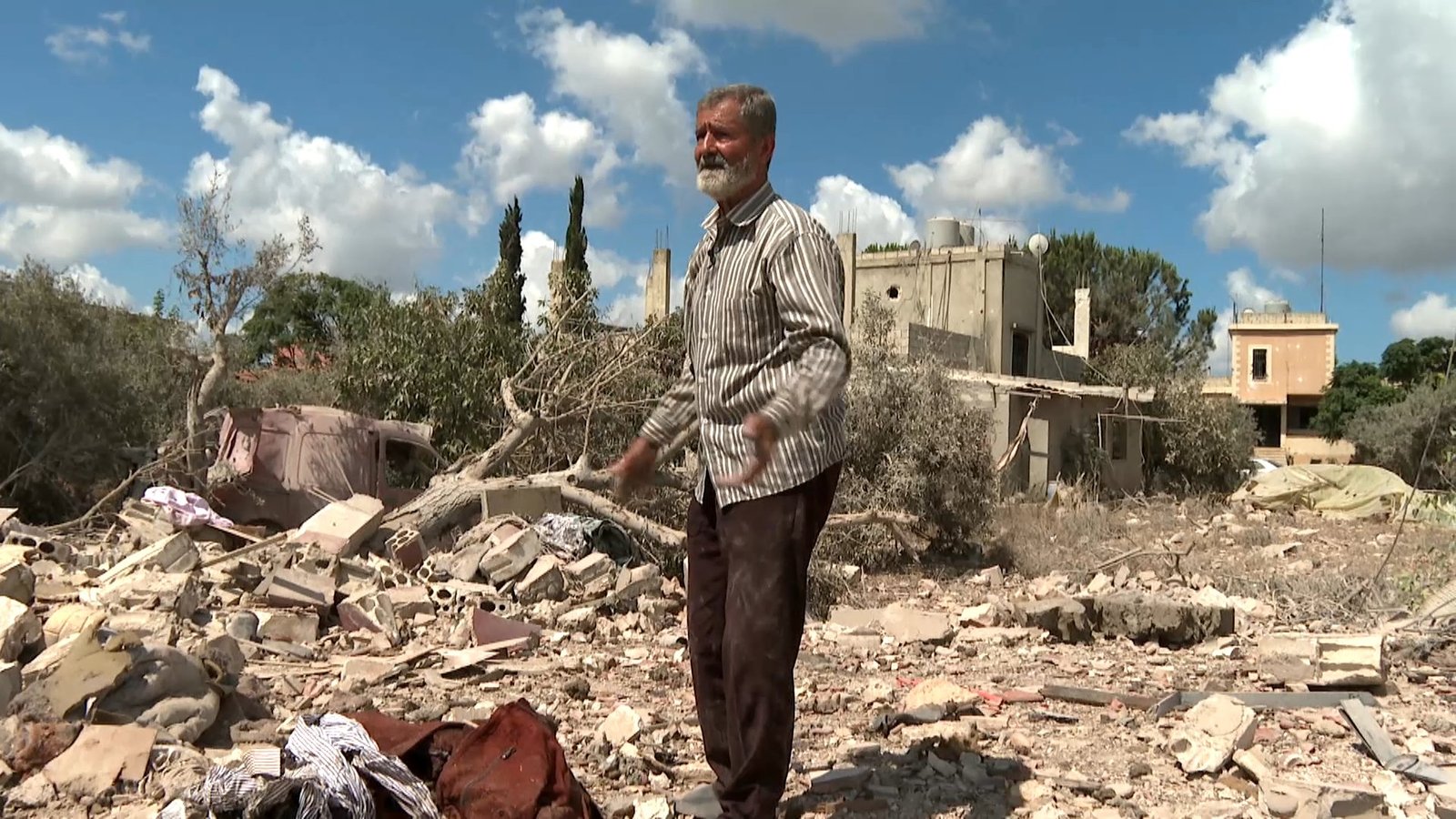 Lebanese civilians survey destroyed homes in southern Lebanon after Israeli military operations during post-ceasefire occupation