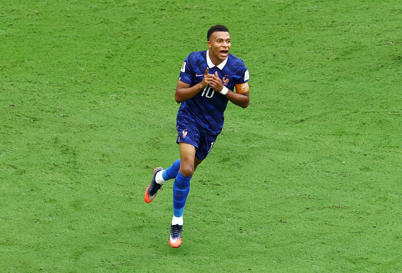Kylian Mbappe celebrates after scoring his 22nd World Cup goal breaking the all-time record against England in Miami