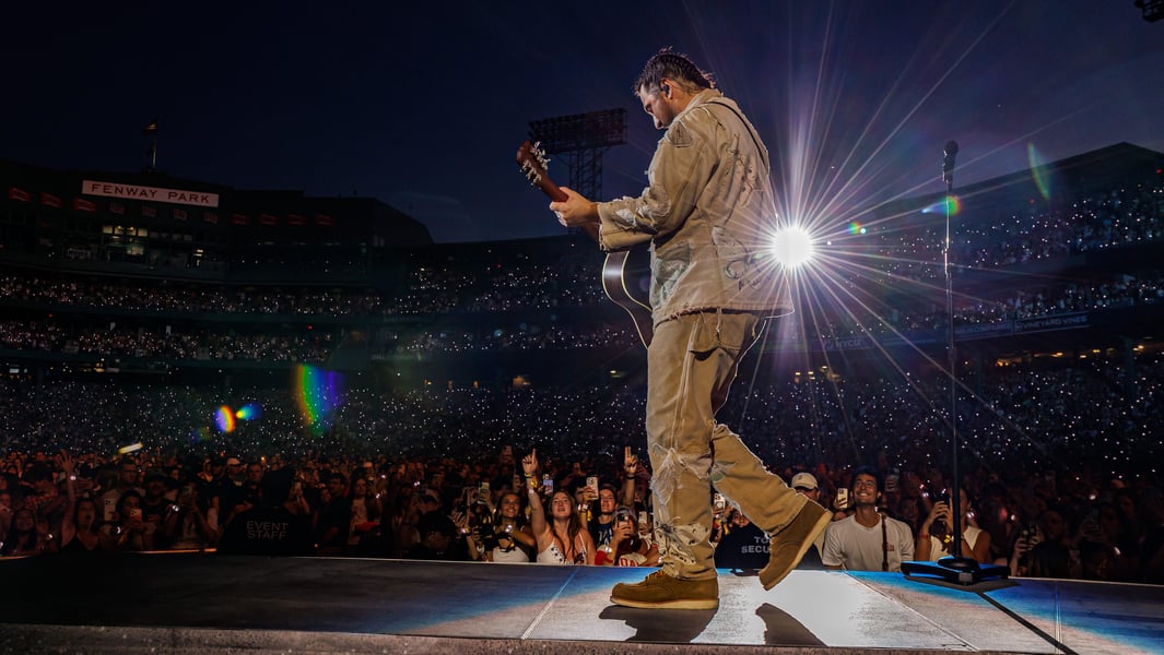 Noah Kahan performing at Fenway Park during The Great Divide Tour in July 2026