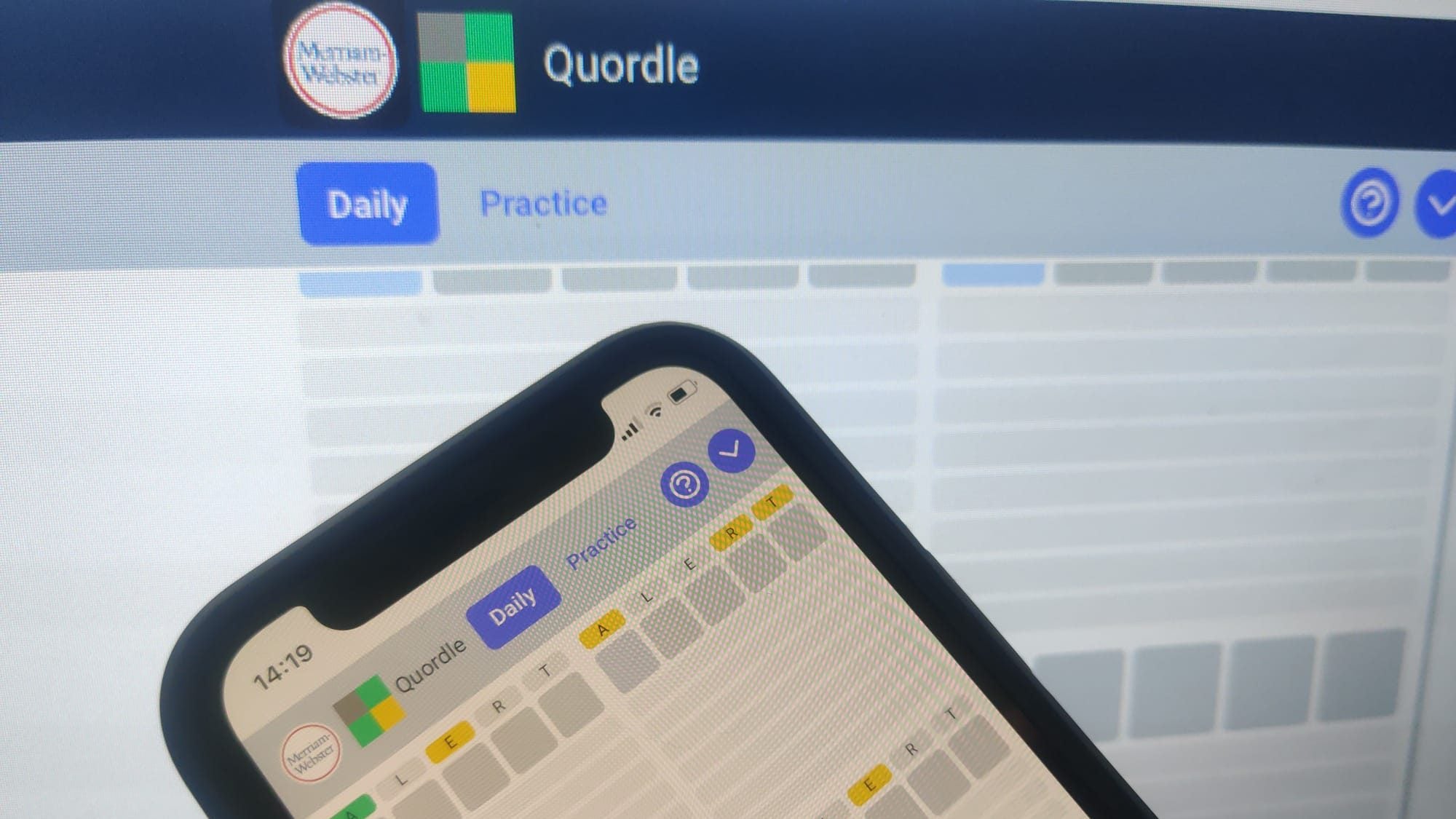 Quordle game board showing four five-letter word grids on a smartphone for game 1630 on July 12 2026