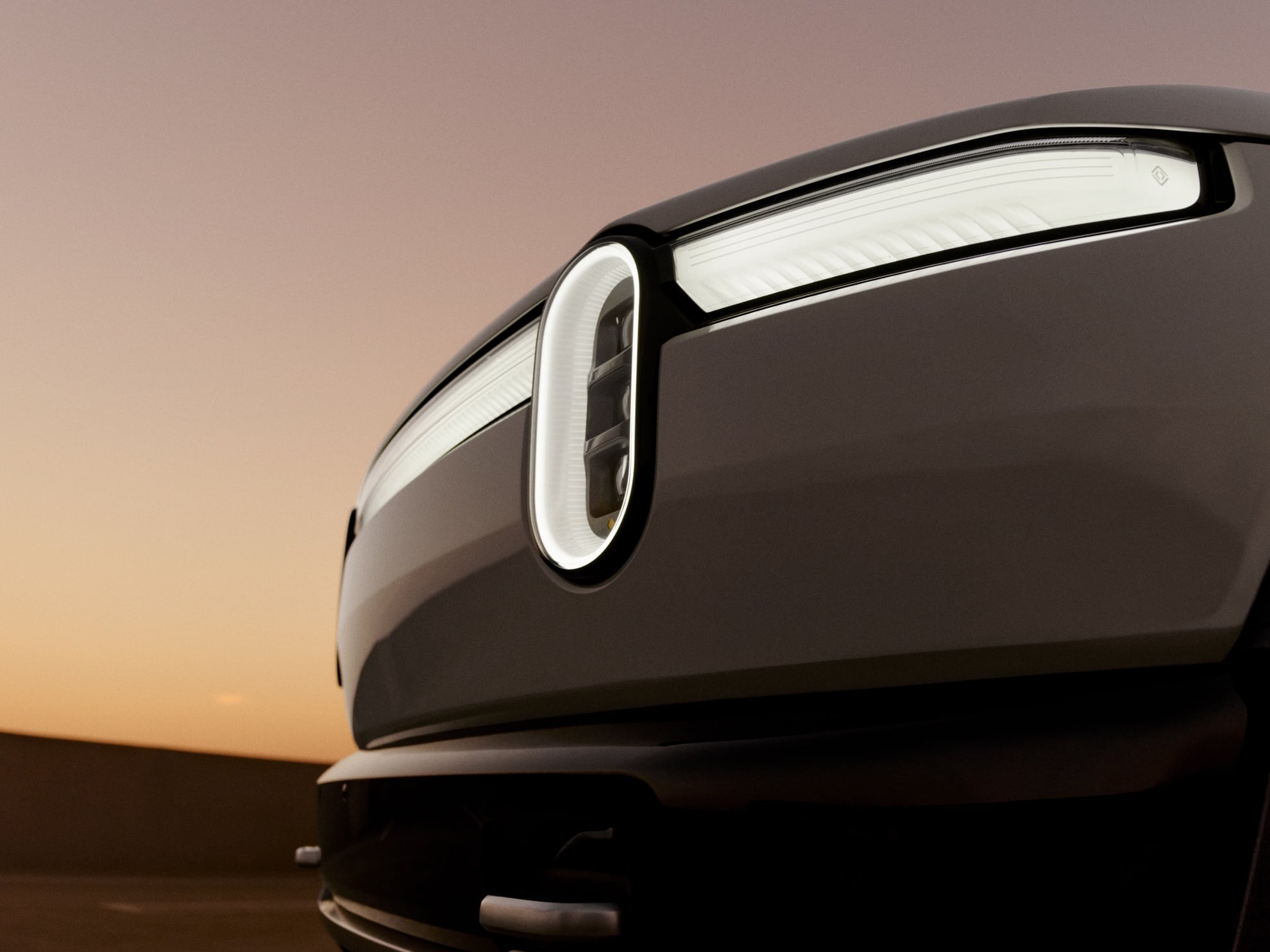Rivian R2 electric SUV headlight as the company beats Q2 2026 delivery targets and raises guidance