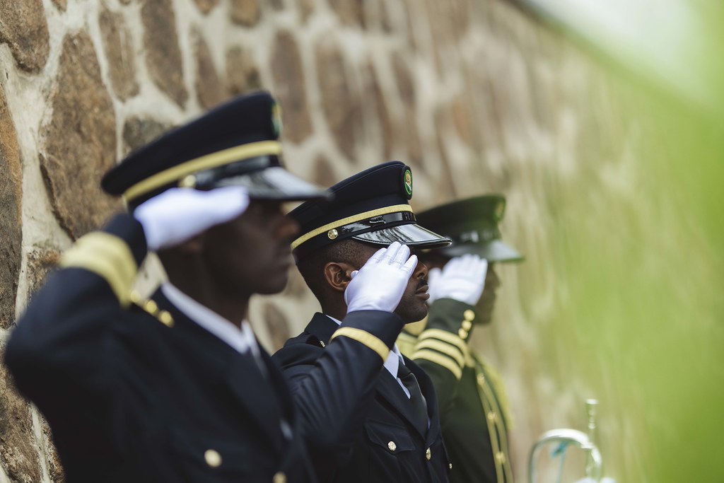 Uniformed Rwandan personnel saluting during genocide commemoration ceremony marking 32 years since 1994 genocide