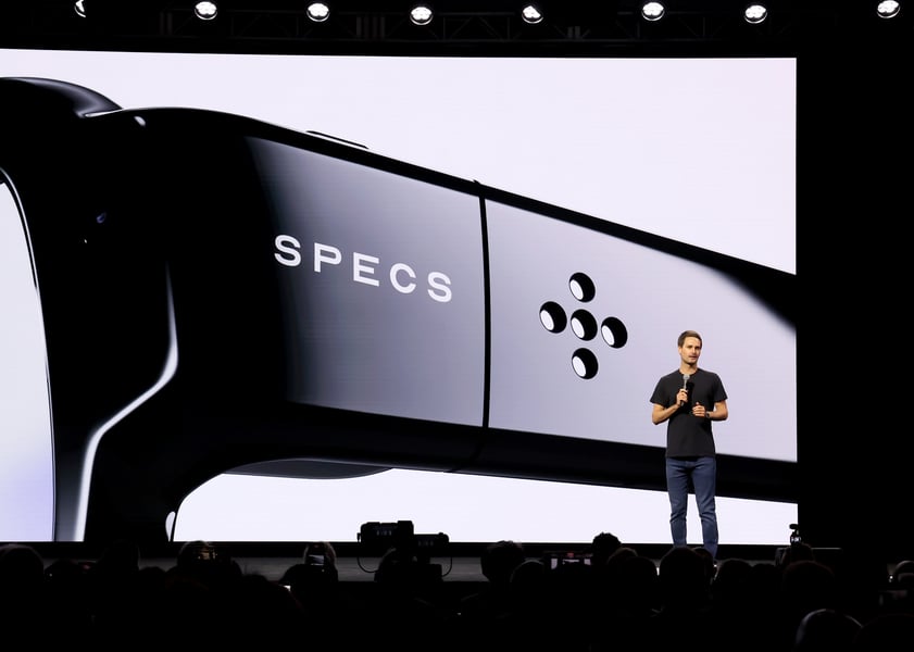 Snap Inc. branding representing Snapchat’s broader platform strategy, including Snap Map, Snap Spectacles AR glasses, and the new Now Playing music feature