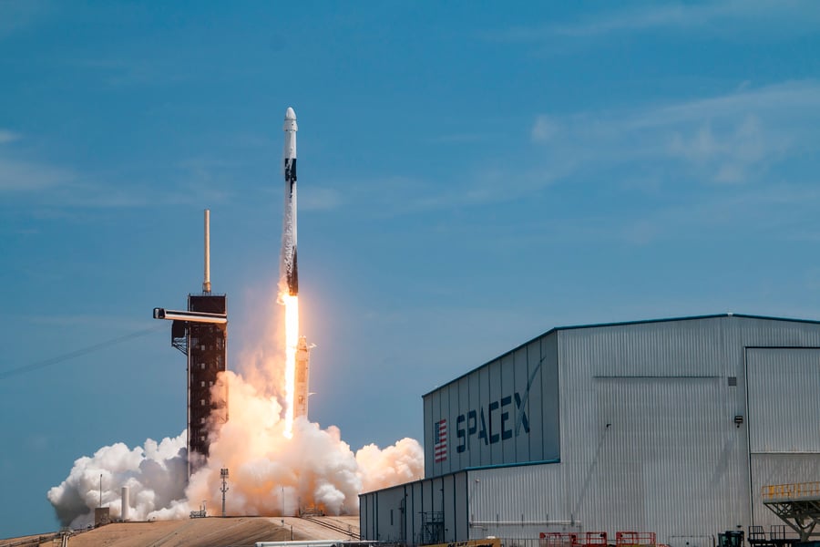 A SpaceX Falcon 9 rocket lifts off from the Florida coast during a cargo resupply mission to the International Space Station