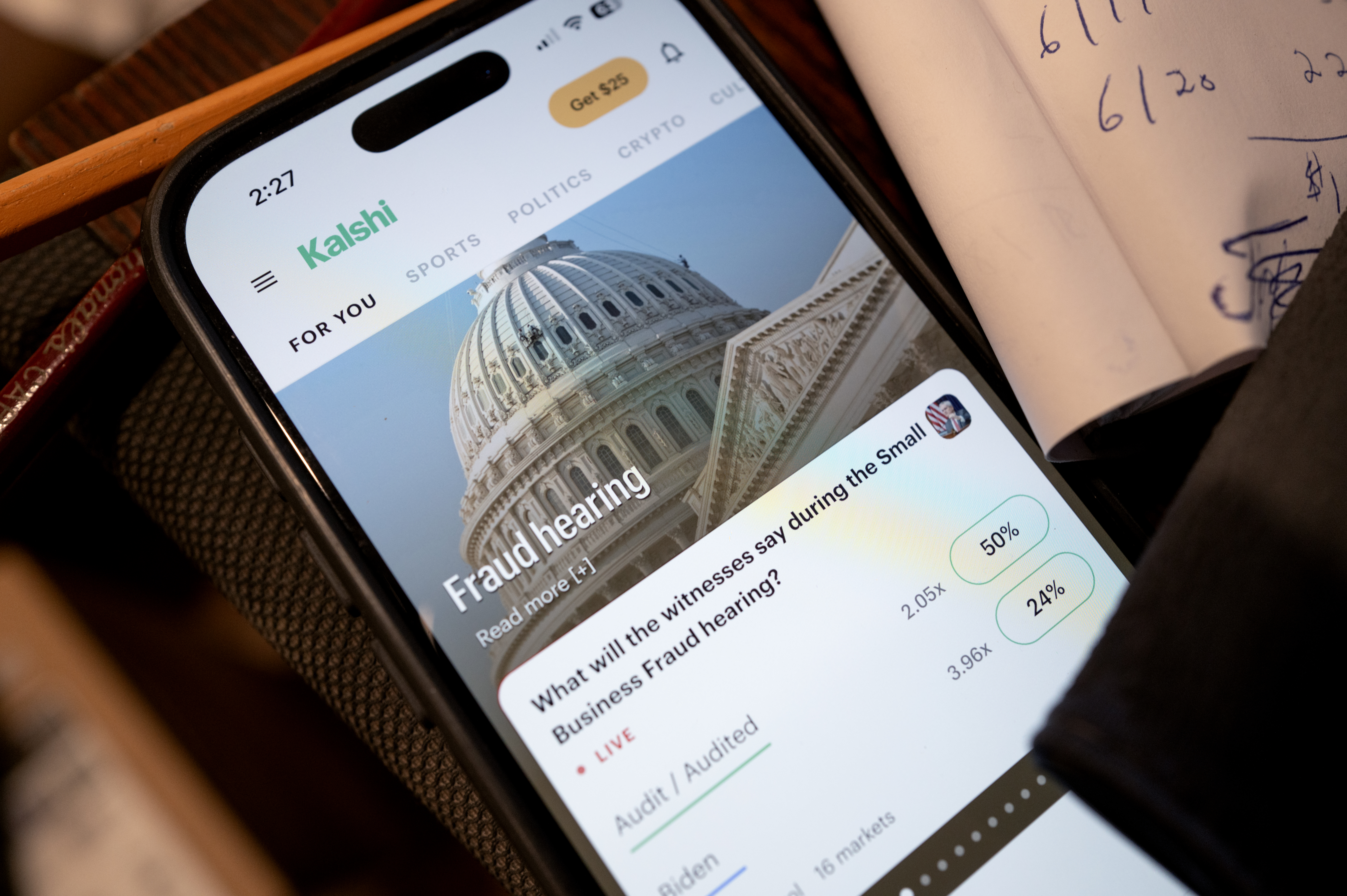 Kalshi prediction market app on a phone screen, at the center of the streaming fraud controversy involving Malcolm Todd's single Earrings