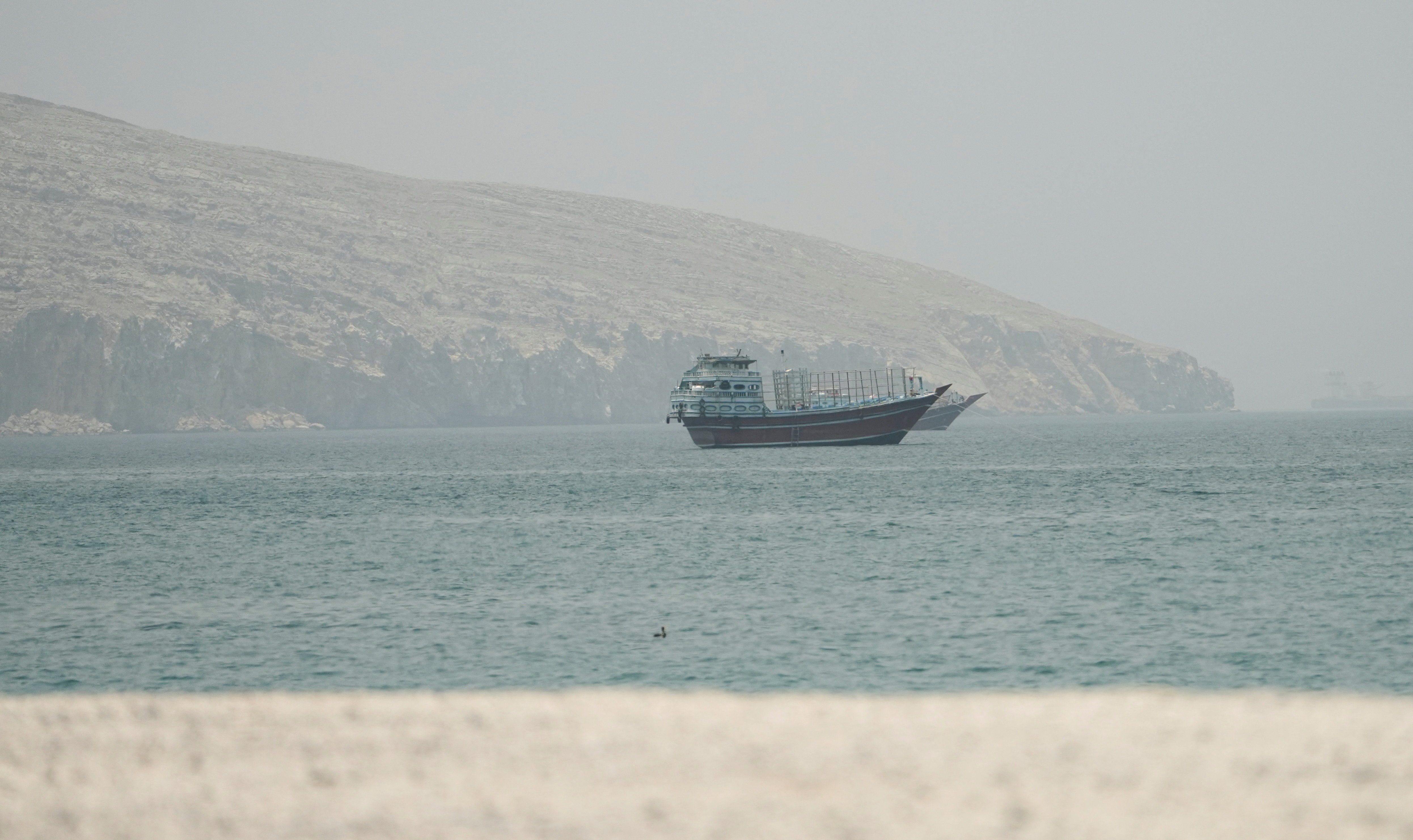 Ships navigating the Strait of Hormuz near Musandam, Oman