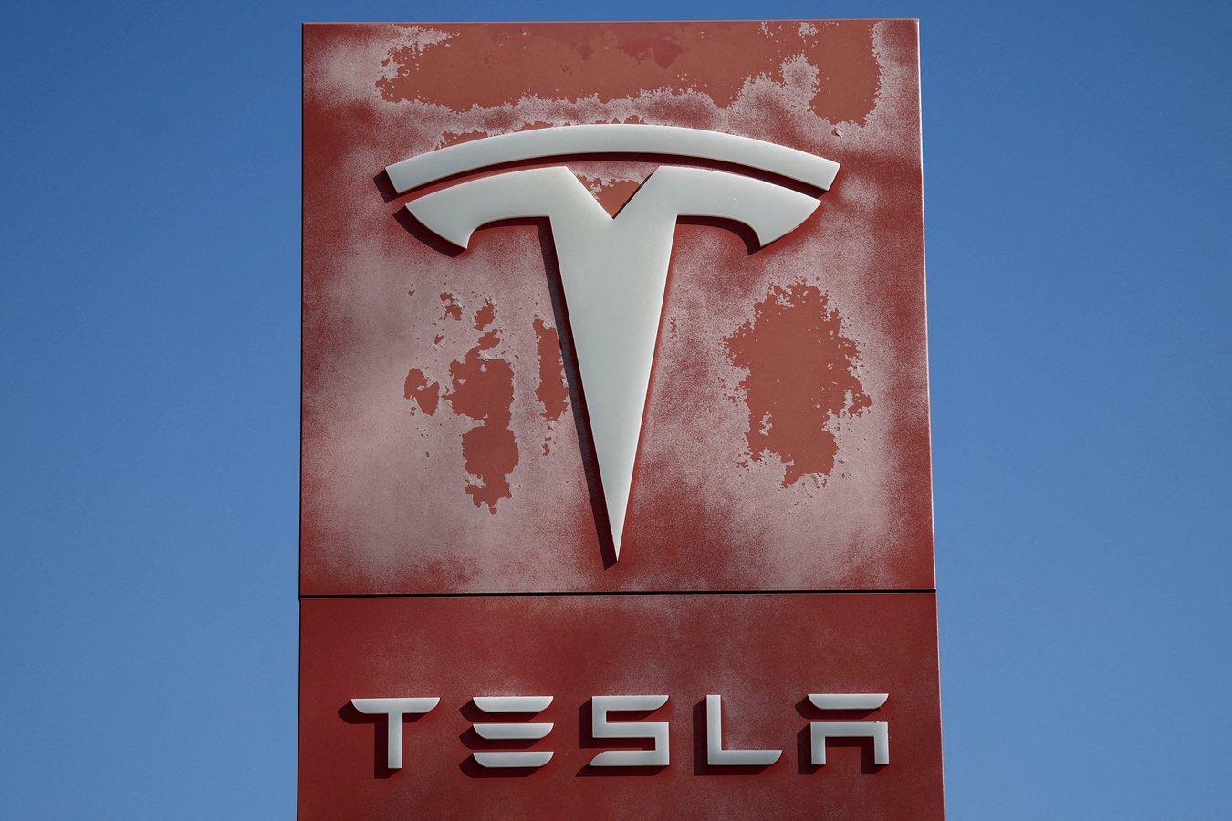Tesla dealership logo as the company reports record Q2 2026 deliveries of 480000 vehicles and misses earnings estimates