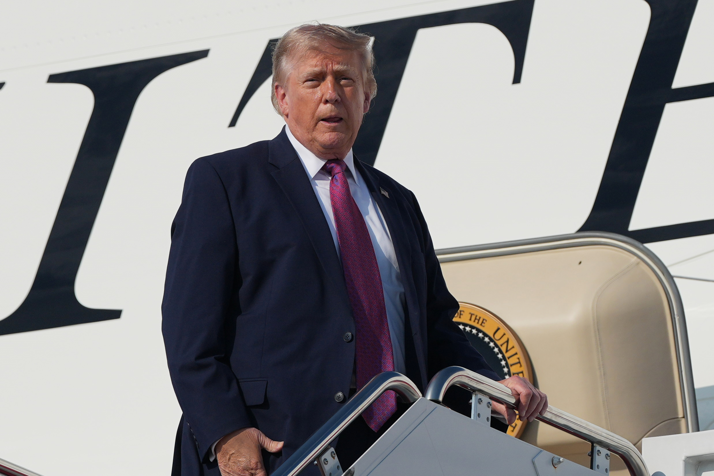 President Trump boards Air Force One ahead of signing Independence Day pardons for Clean Air Act violators
