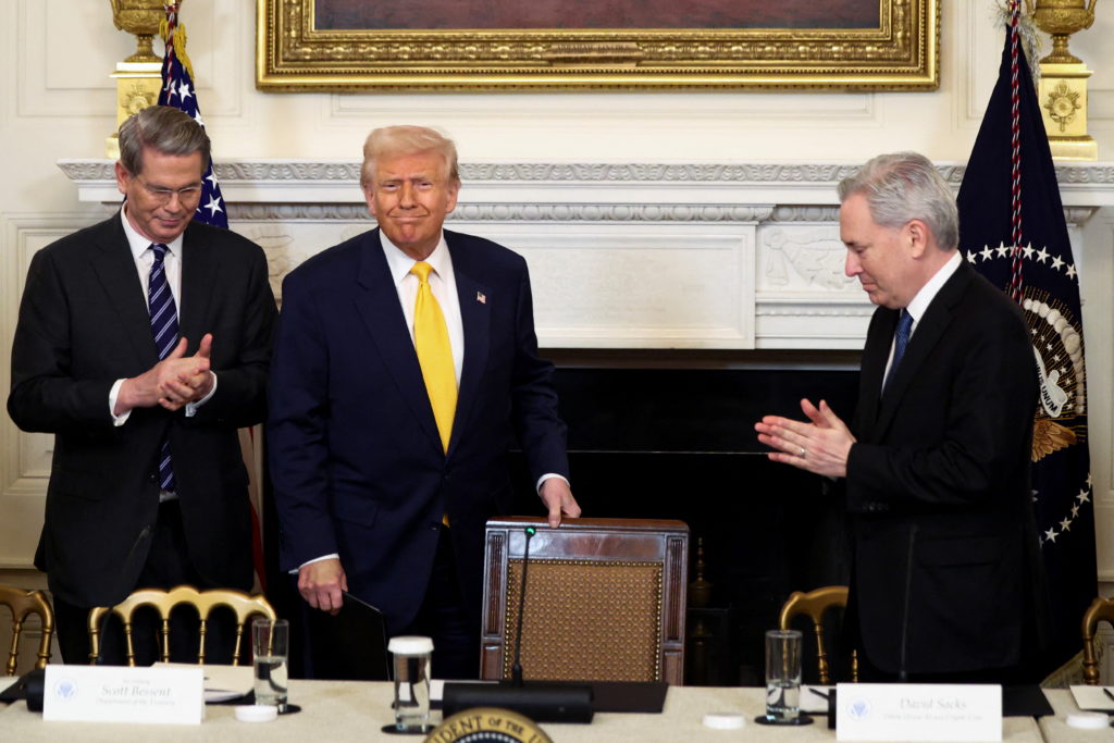 President Donald Trump at a White House crypto event as his 2025 financial disclosure revealed $1.4 billion in cryptocurrency earnings