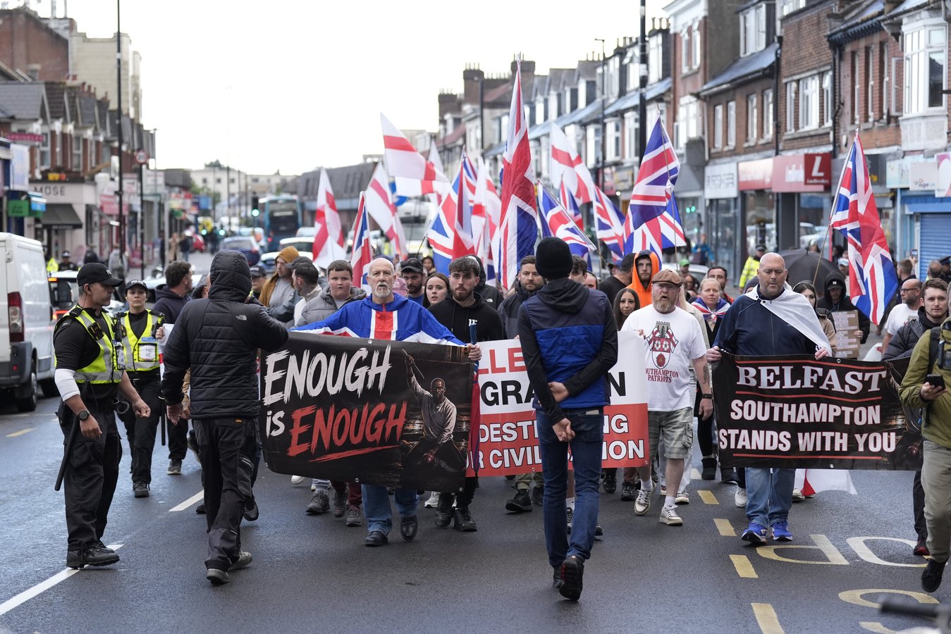 Far-right protesters holding banners in Southampton, UK, ahead of counter-terrorism arrests targeting an Ijtima Muslim festival plot