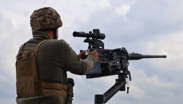 Ukrainian air defense units repelling a Russian drone and missile assault over Ukraine