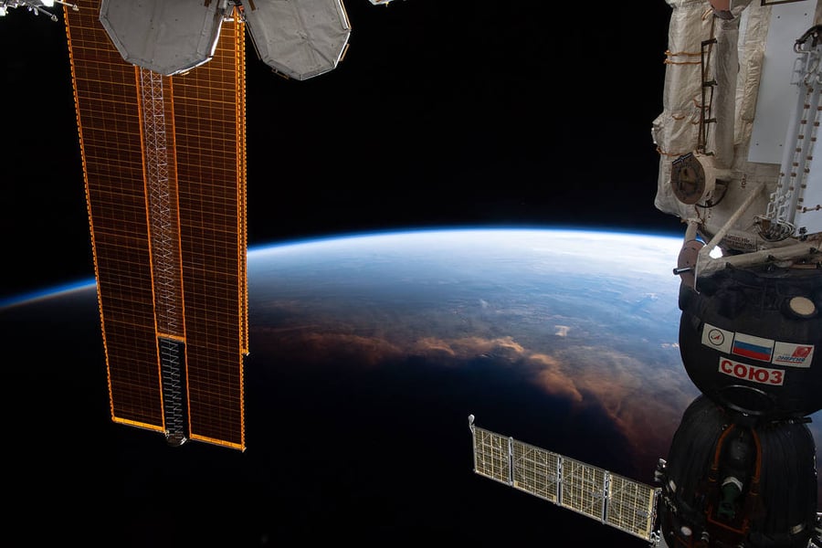The International Space Station crossing the terminator, the line separating night from day on Earth, seen from orbit