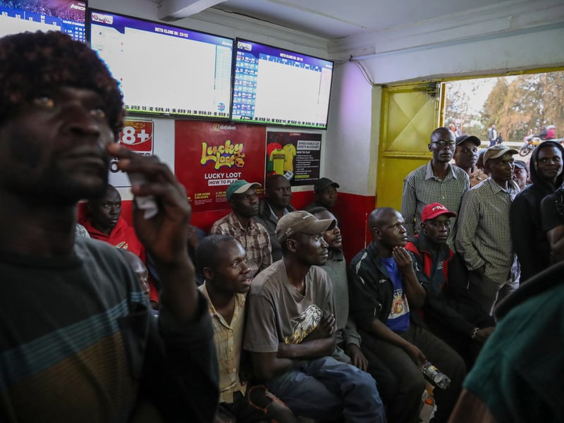 Sports betting shop in Africa with customers placing bets, as Nigeria Kenya and South Africa move to regulate the iGaming industry