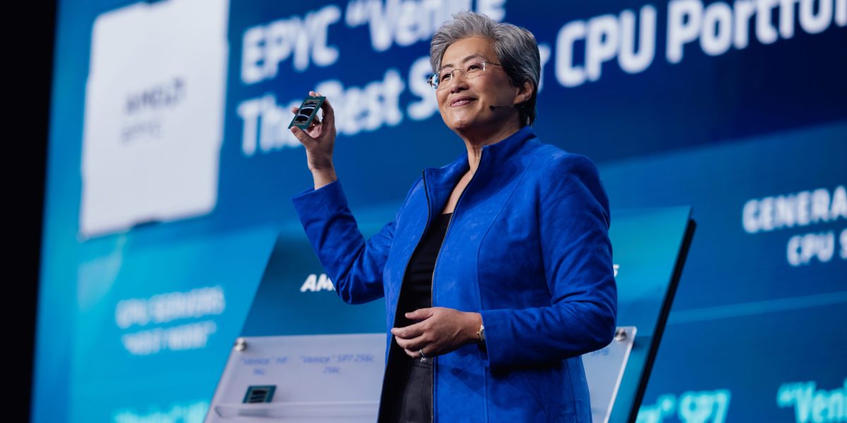 AMD stock today: chair and chief executive Lisa Su holds a processor on stage at the AMD Advancing AI keynote in July 2026