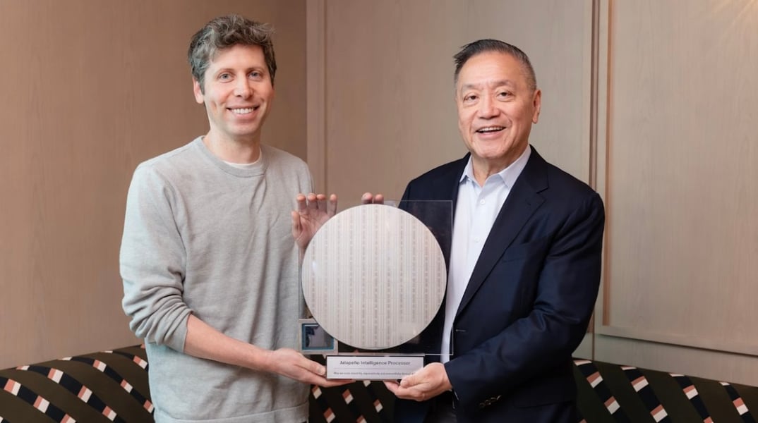 AVGO stock today: OpenAI chief executive Sam Altman and Broadcom chief executive Hock Tan hold a mounted wafer of the Jalapeno inference processor