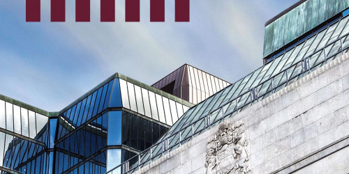Bank of Canada headquarters building exterior in Ottawa with the red Bank of Canada logo and classical stone facade