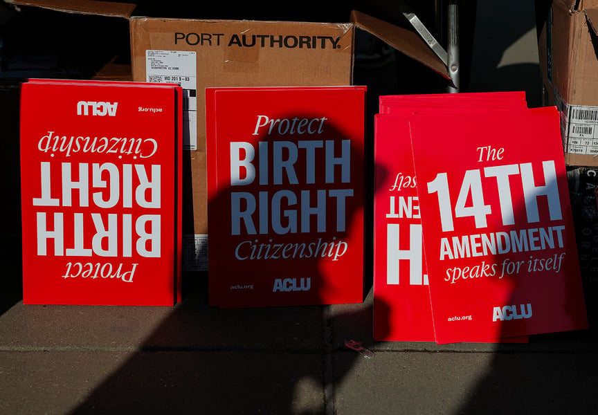 Birthright citizenship placards held during a demonstration outside the US Supreme Court in April 2026