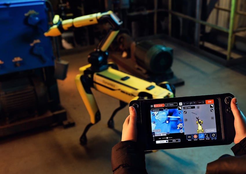 Boston Dynamics SPOT robot using its extendable arm to manipulate objects, demonstrating its law enforcement utility