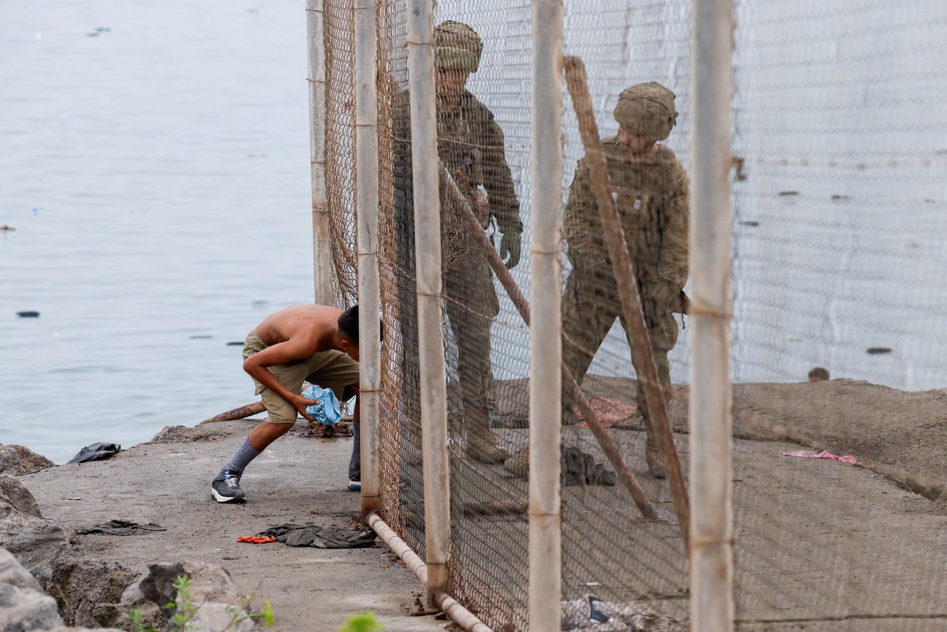 Migrants at Spain-Morocco border crossing in Ceuta during July 2026 mass surge