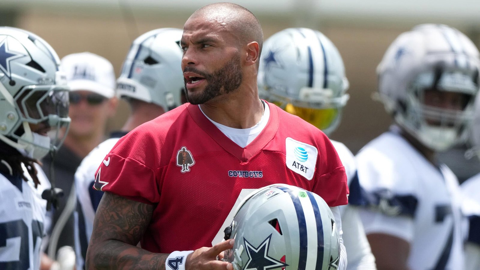 Dak Prescott in red quarterback jersey at Dallas Cowboys training camp 2026 ahead of the NFL season