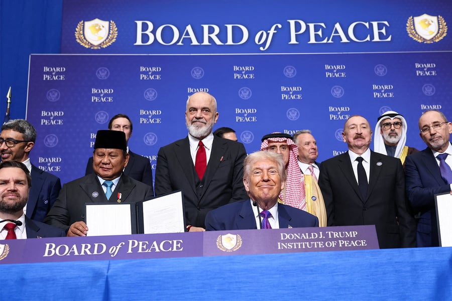 US President Donald Trump seated at a meeting in Washington DC in February 2026