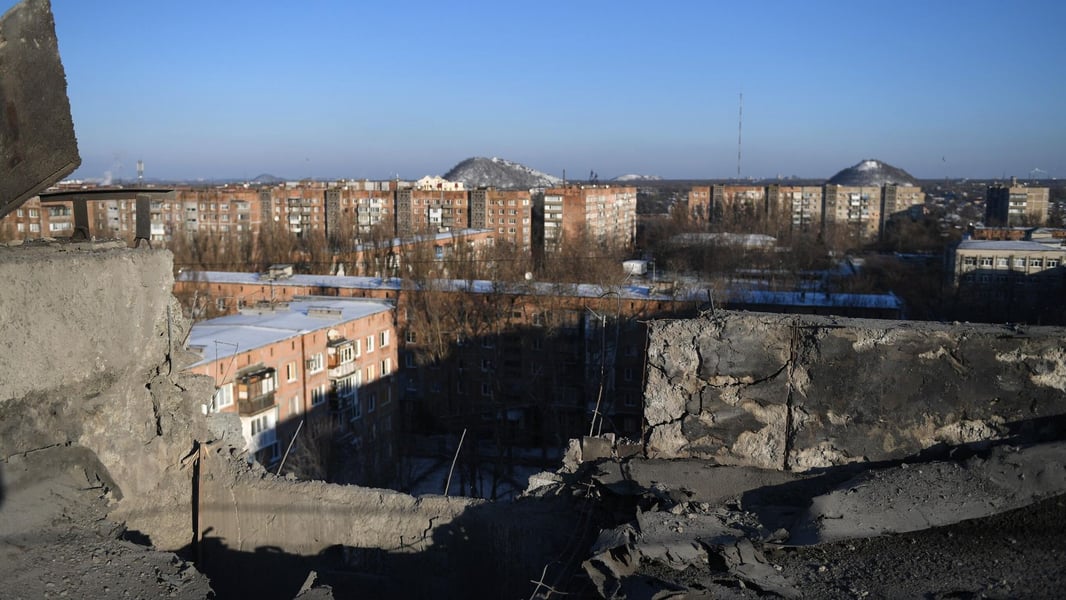 View across a Donbas city from inside a shelled building in winter