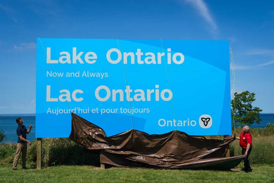 Ontario Premier Doug Ford in Team Canada jersey unveiling the Lake Ontario Now and Always billboard at Grimsby