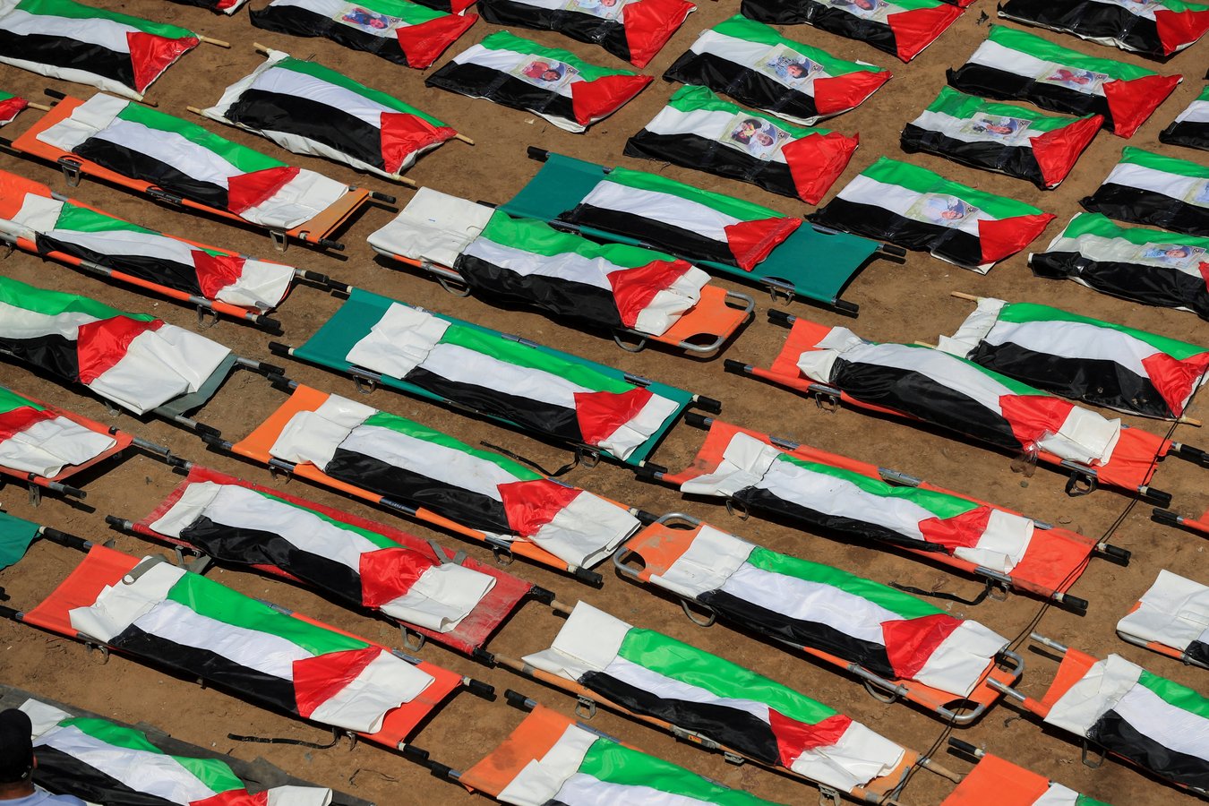 Mourners at the mass funeral in Sabra Gaza City for 112 members of the Abu Sharia and Hassayna clans killed in an Israeli airstrike in 2023