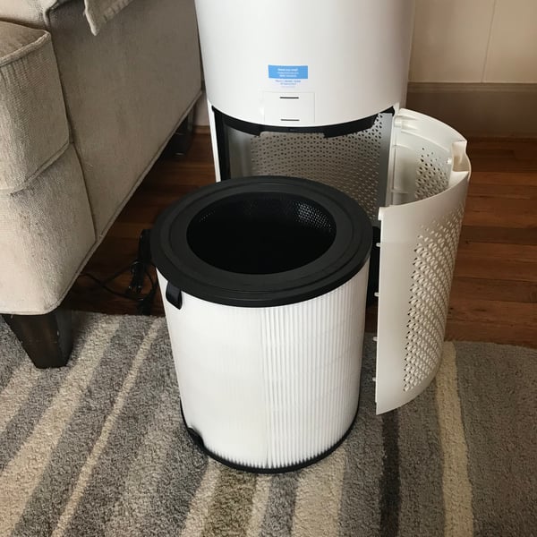 Levoit HEPA air purifier with filter exposed, used in indoor air quality research