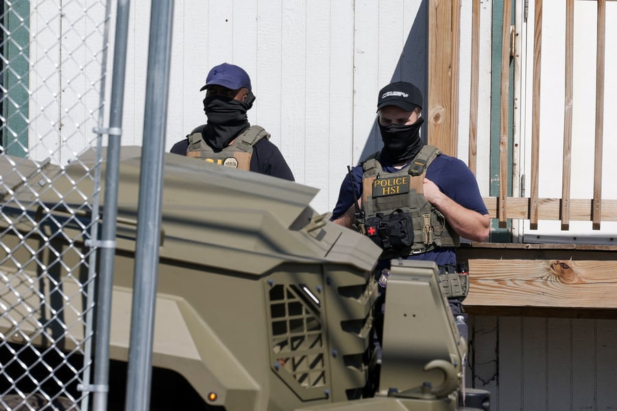 US Immigration and Customs Enforcement ICE agents standing guard outside Delaney Hall immigration detention center in Newark New Jersey June 2026