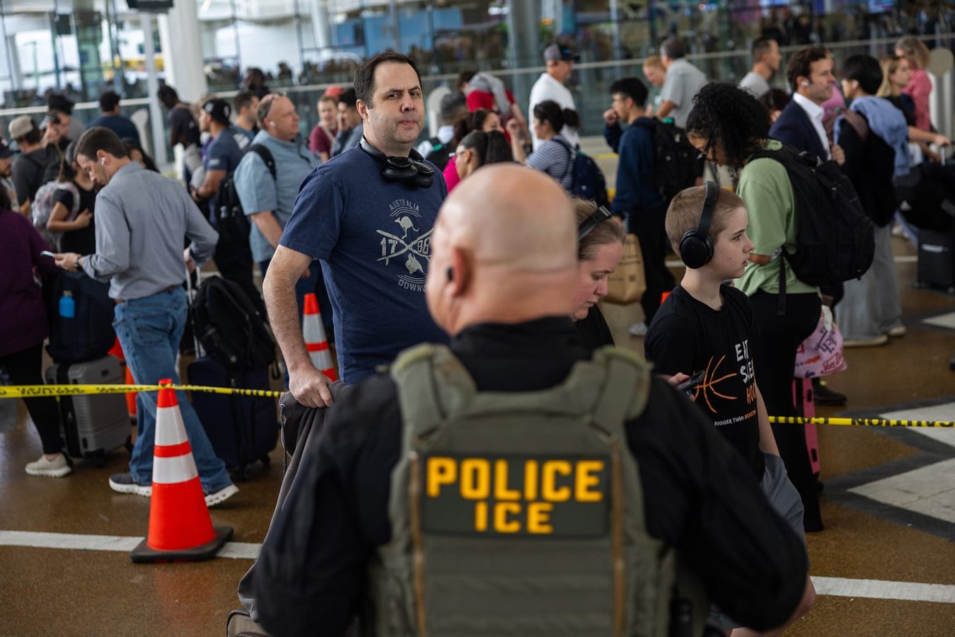 ICE officers conduct enforcement at US airport 2026 as immigration detentions reach record high