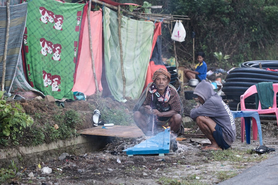 Displaced residents shelter outside a makeshift tent in Reo East Nusa Tenggara after the Indonesia Flores earthquake killed 65 people