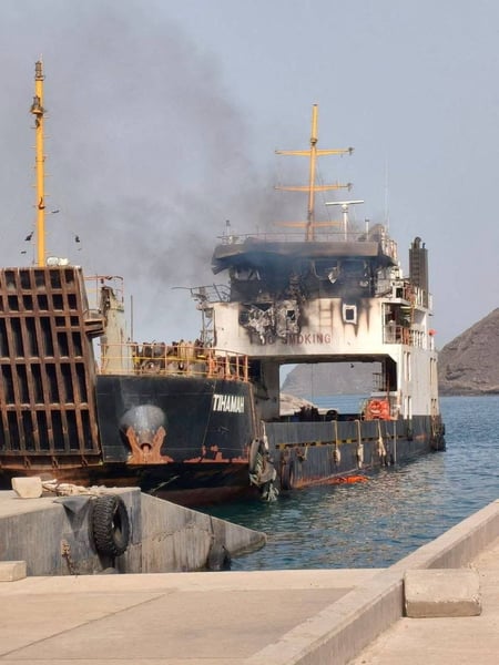Commercial shipping in the Gulf of Oman under US Navy blockade enforcement as Vela Nova containership is disabled August 11 2026