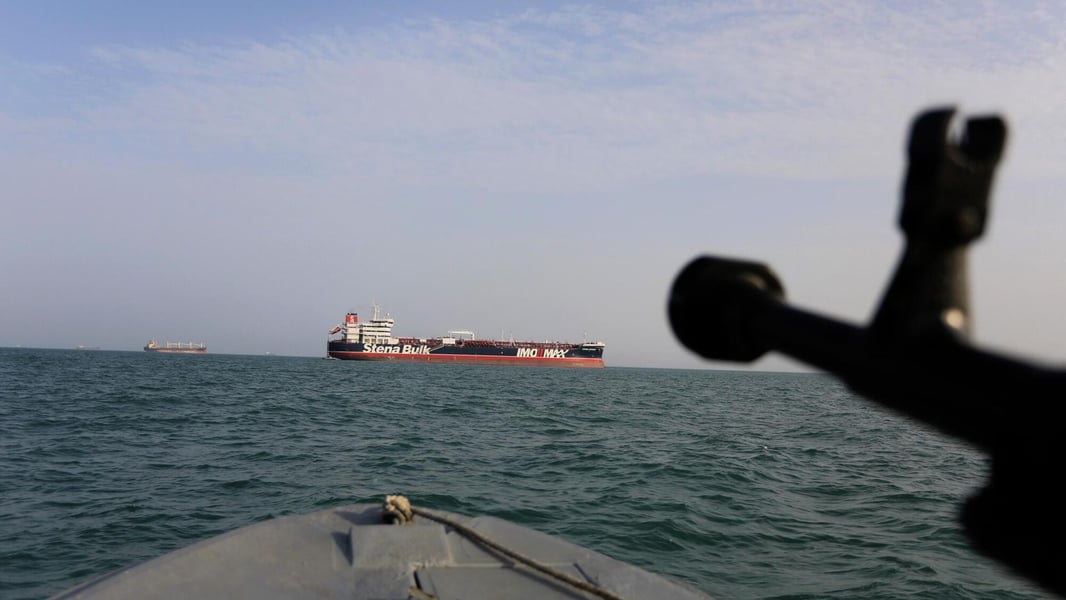 Iranian Revolutionary Guard speedboat patrols the Strait of Hormuz where Iran now blacklists non-compliant vessels