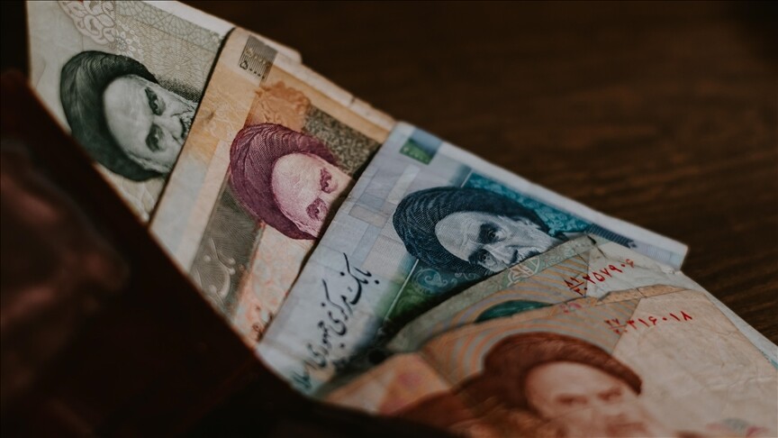 Iranian rial banknotes at currency exchange as US announces economic D-Day sanctions against Tehran