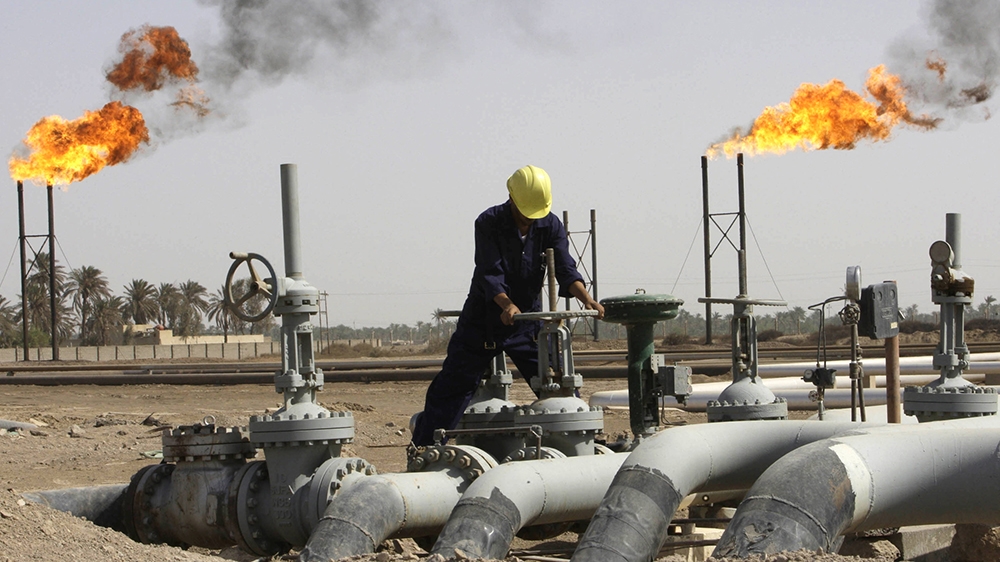 Iraqi oil worker at a refinery near Basra as Turkey and Iraq sign the Kirkuk-Ceyhan pipeline deal