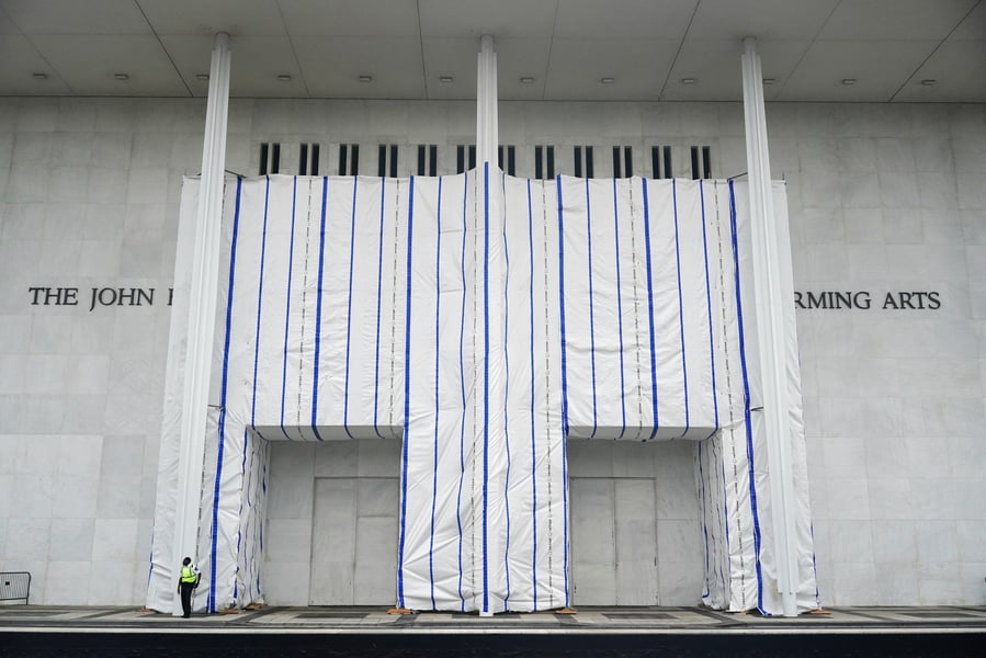 A tarp covers the facade of the John F. Kennedy Center for the Performing Arts after a federal judge ordered Trump name removed June 2026